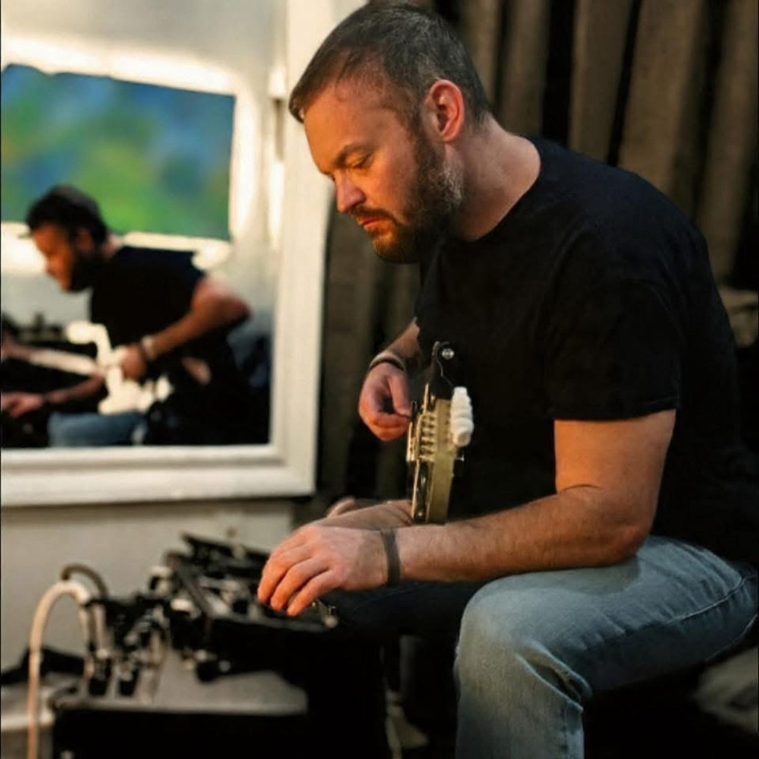 John Leonard playing electric guitar